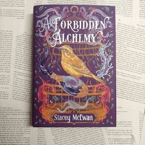 A Forbidden Alchemy By Stacey McEwan from Owlcrate's Quarterly Romantasy Box.